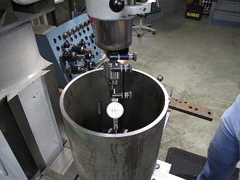  With the bridgeport knee all the way to the bottom and the ram pulled out a bit more, we do our best to center the pipe in the mill. We discover the pipe is not completely round by about 15 thou. Not a problem since the boiler is almost 1/8